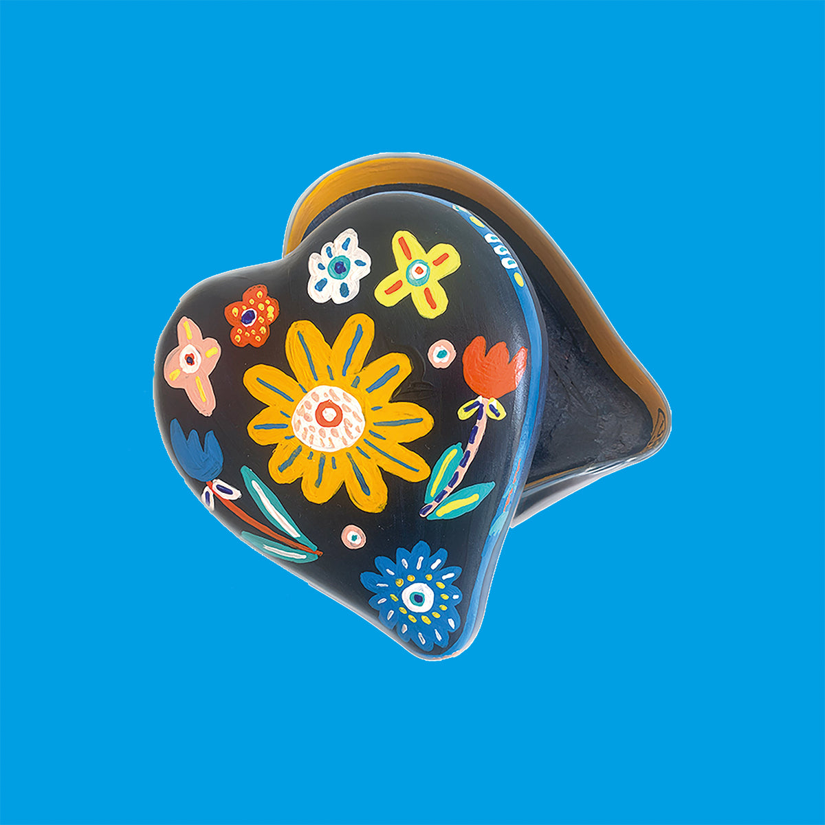 Blumen Motive zieren die schöne Dose. Illustriert ist die Dose von der Illustratorin Ursula Tücks.